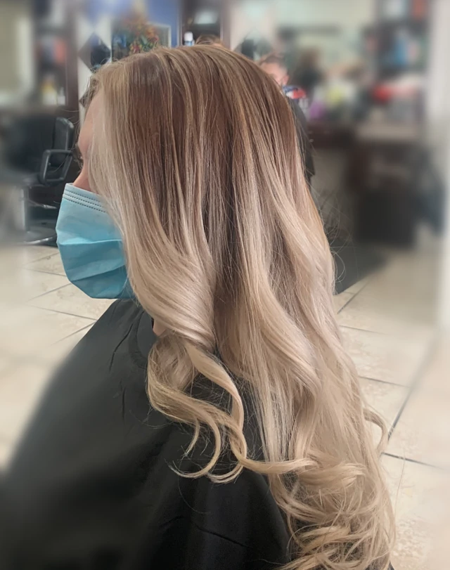 Long blonde waves viewed from the side
