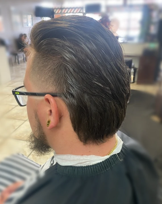 Slicked-back haircut with short sides viewed from behind