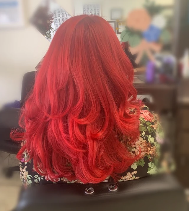 Long red curls viewed from behind